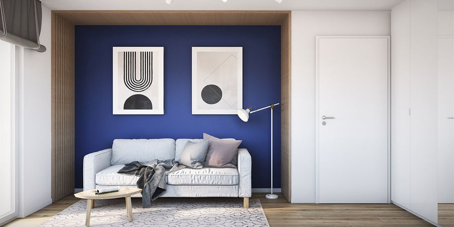 Gästezimmer mit Couch und blauer Wand