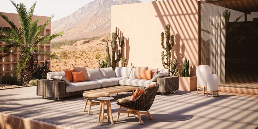 Garten Lounge Möbel auf einer Terrasse mit Kakteen.